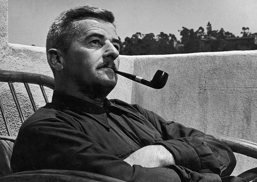 William Faulkner with a pipe.