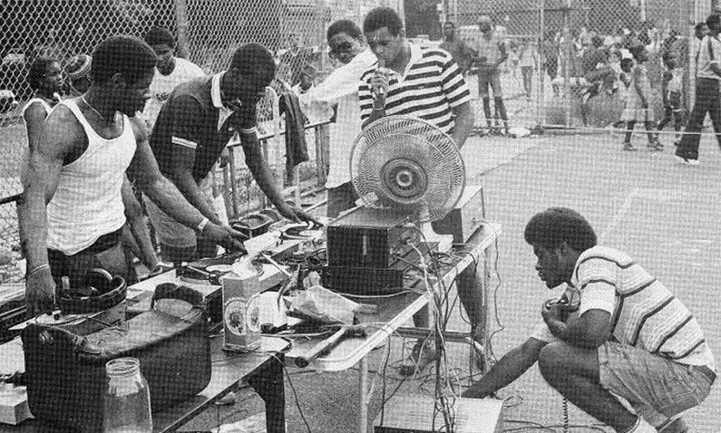 Men around a DJ percussion area