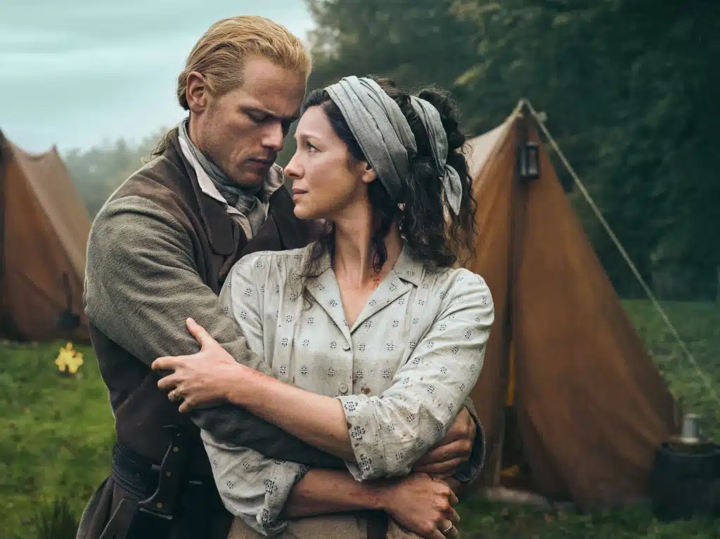 Claire and Jamie holding each other in Outlander photo