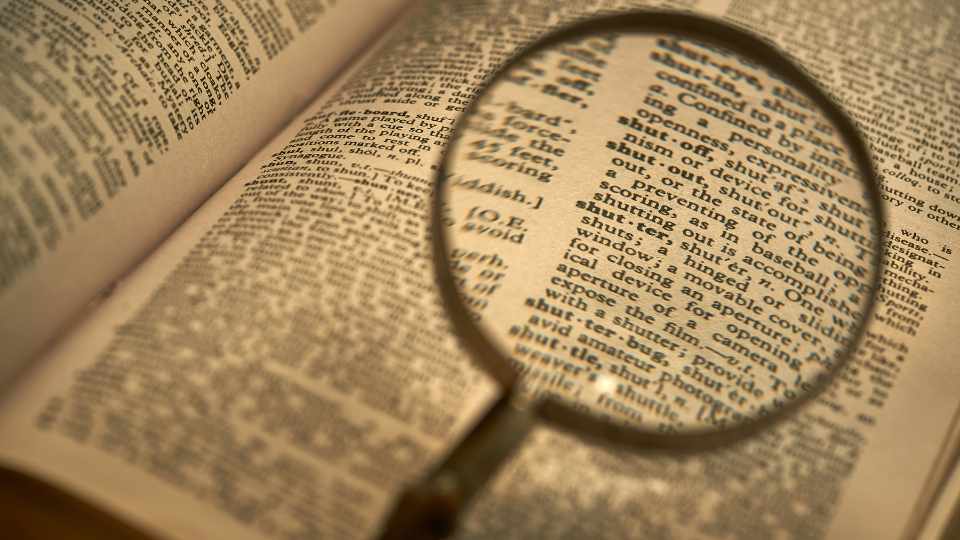 english-language-dictionary-with-magnifying-glass