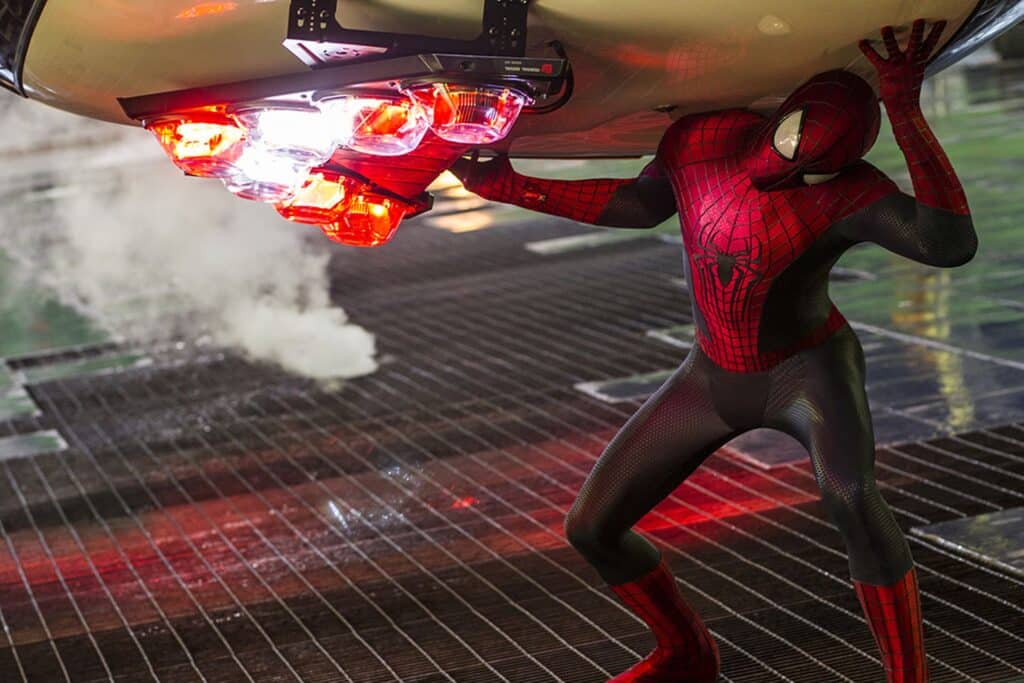 Andrew Garfield as Spider-Man-- holding over a car