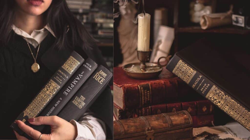 Two images side by side.On the left, our Bookstagrammer of the Week, Danielle of @draculelle, is holding three books. They are hardcover copies of Bram Stoker's Dracula, Nick Groom's The Vampire, and Anne Rice's The Vampire Armand. She is wearing a dark sweater with a white collared shirt underneath. A gold chain hangs around her neck and she is wearing dark lipstick that matches the color painted on her nails. On the right, the same hardcover copy of Bram Stoker's Dracula is leant up against two other books. There is an old candlesitck holder sitting atop the two books.cr. Danielle / @draculelle