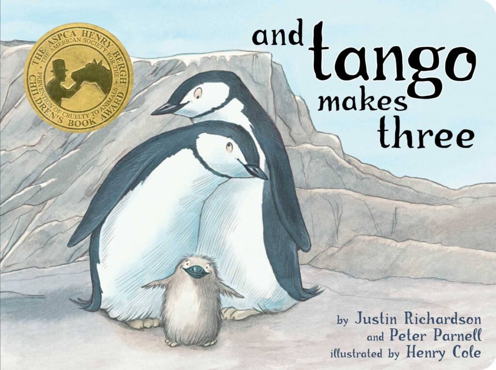 "And Tango Makes Three" written by Justin Richardson - two older penguins with a baby one in the middle of them - book cover.