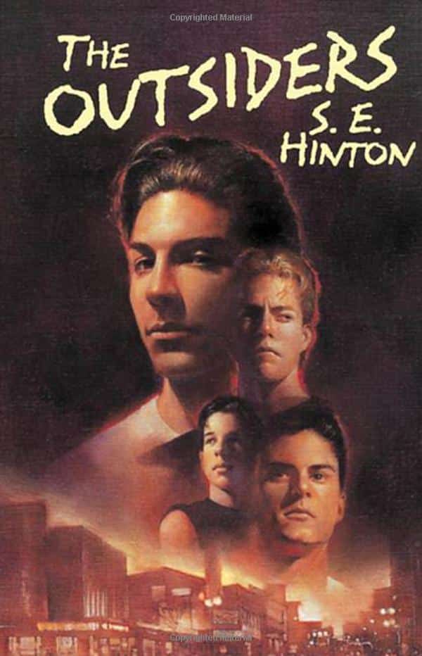 60s-kids-check-out-your-birth-years-most-popular-book-the-outsiders-book-cover-dark-brown-cover-with-people-fading-down-into-a-city