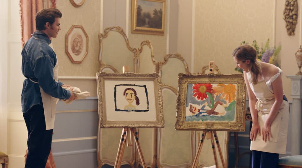 Actors Luke Newton and Claudia Jessie admire paintings of each other that they have made.