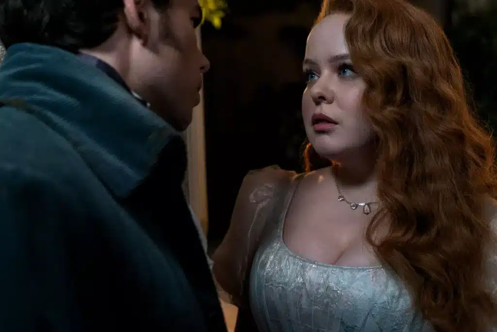 Colin Bridgerton and Penelope Featherington look intensely at each other.