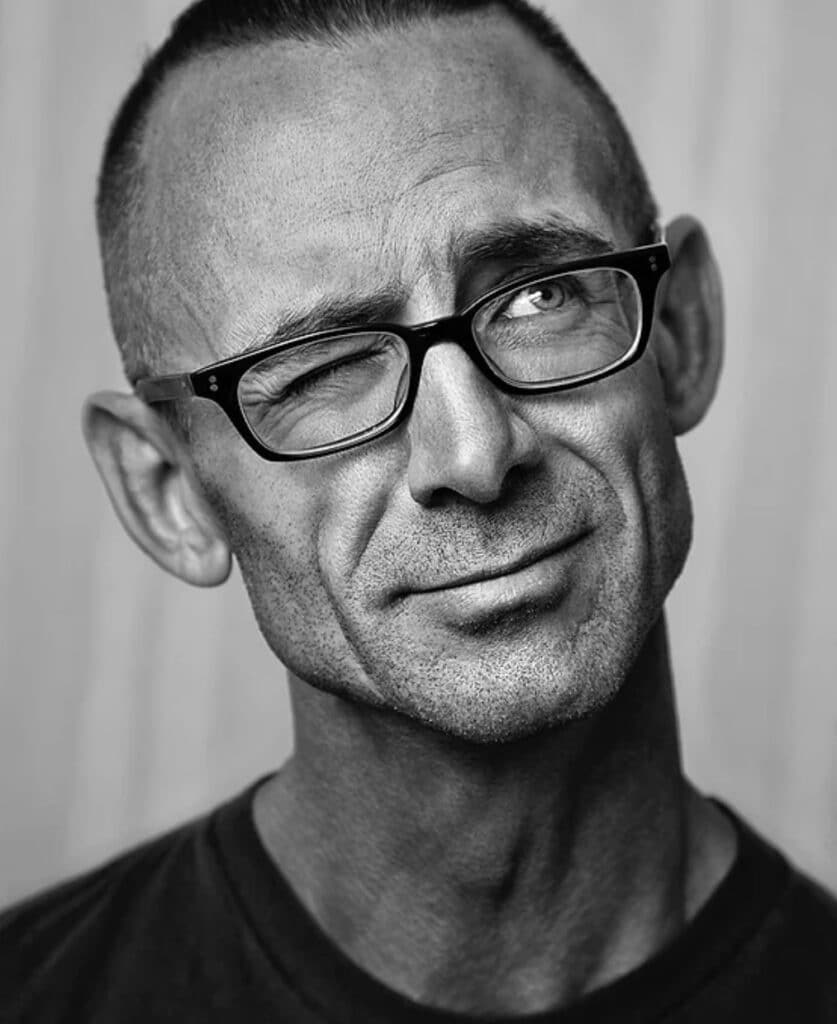 Chuck-Palahniuk-headshot-with-glasses-one eye-closed-mispronounced-author-names