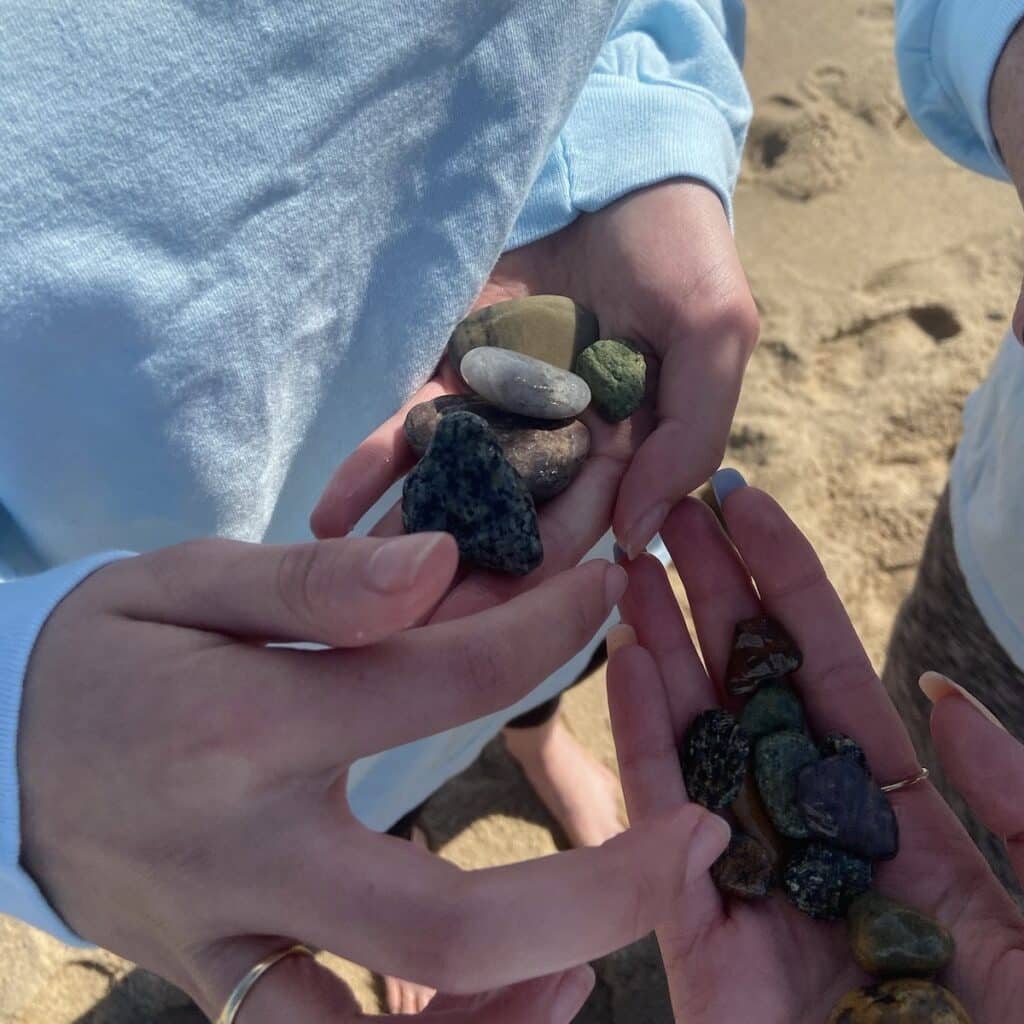 two-hands-holding-rocks-at-the-beach-poems-poetry-ocean