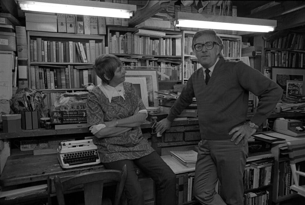 Ray Bradbury posing with wife Maggie, home office, typewriter.