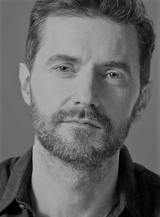 black-and-white-photo-of-richard-armitage-smiling audiobook narrators