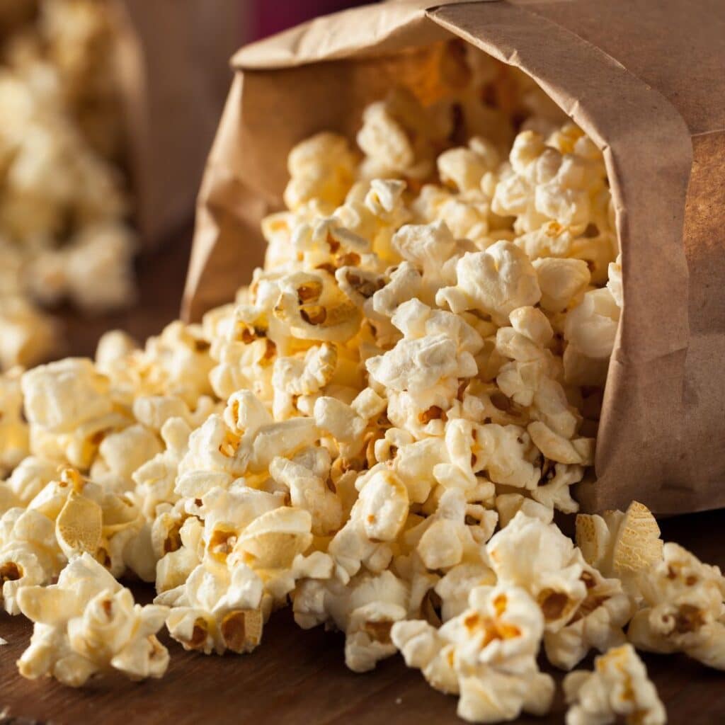 A paperbag full of popcorn spilling-food-truck-genre-reading