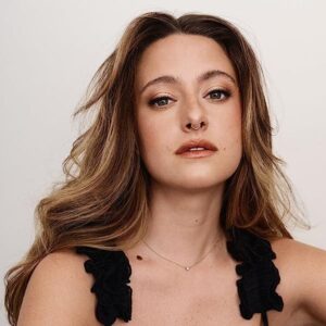 haley-jakobson-portrait-young-woman-neutral-look-to-camera-wearing-black-sadness
