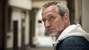 Olivier Norek with blurred background