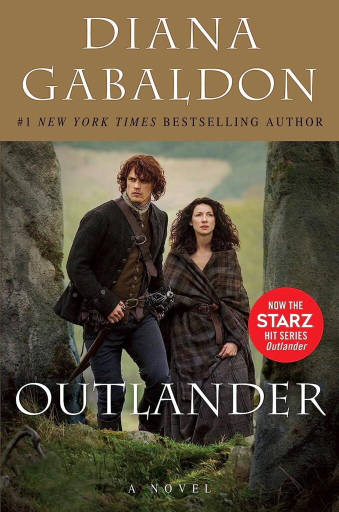 most-popular-books-published-each-year-in-the-90s-outlander-book-cover-guy-and-girl-standing-between-trees