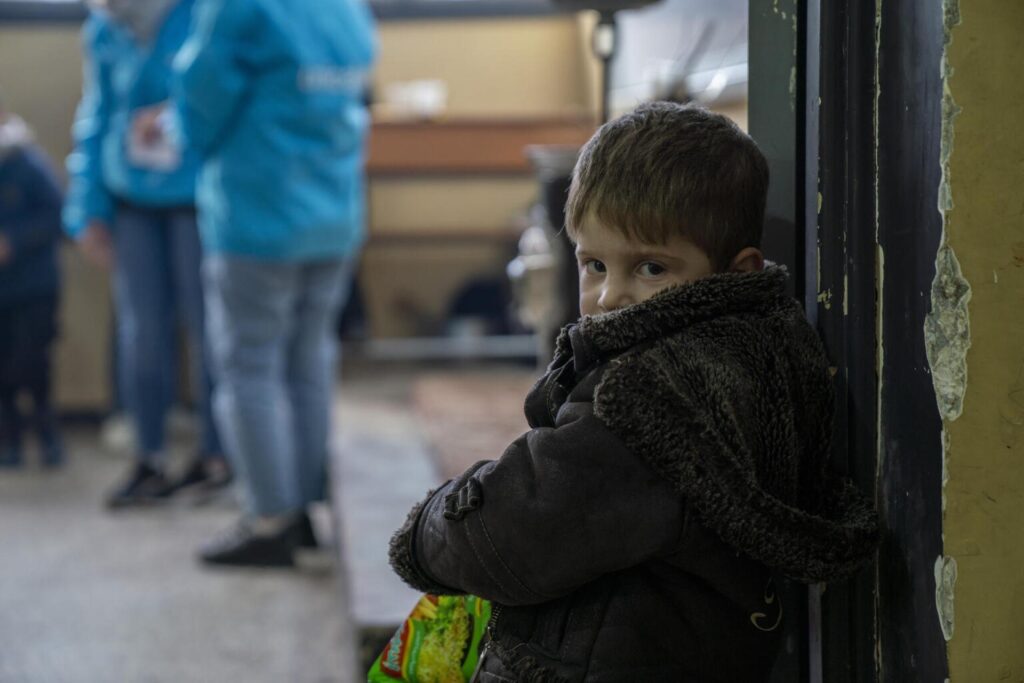 A scared child during the war in Syria