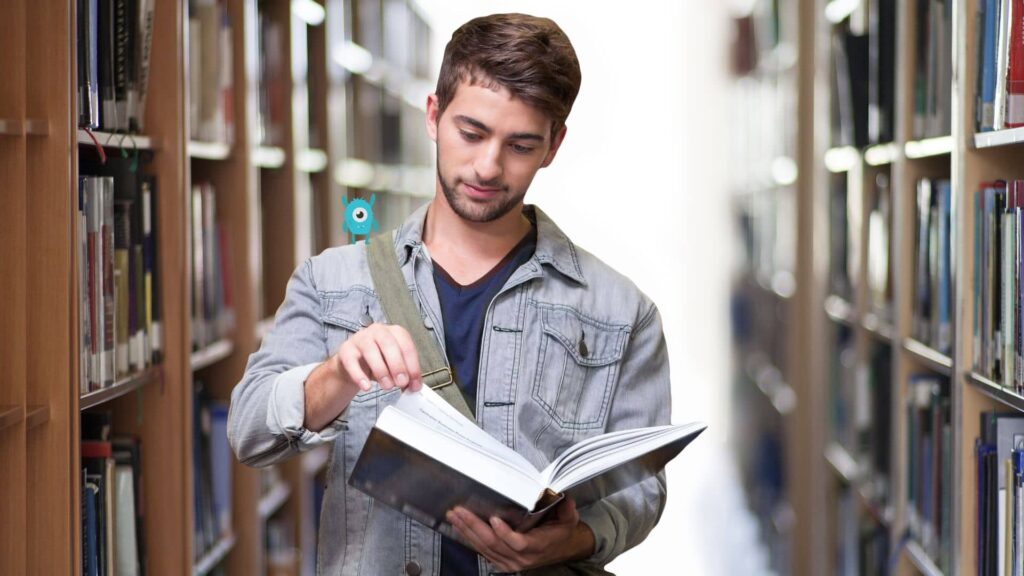 man-walking-down-a-library-while-reading-a-book-and-the-small-blue-one-eyed-tbr-monster-is-on-his-shoulder-smiling